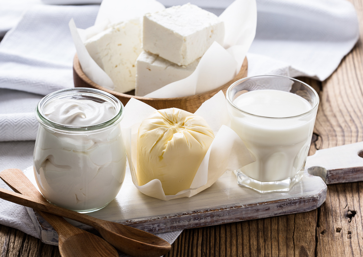 dairies-Organic dairy products on rustic wooden table. Cheese, milk, butter, sour cream