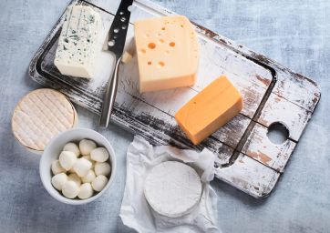 cheese-Italian cheeses-New Zealand-Different kinds of cheeses on rustic wooden board-cheese
